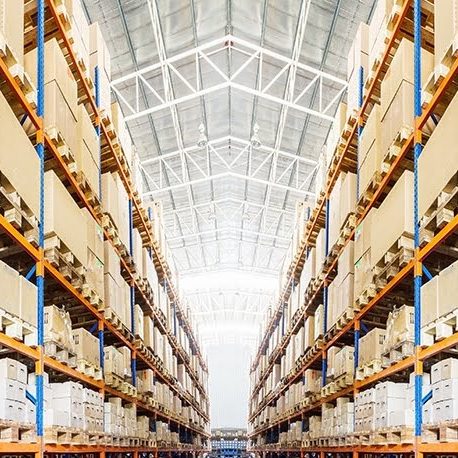 Rows of shelves with boxes in modern warehouse