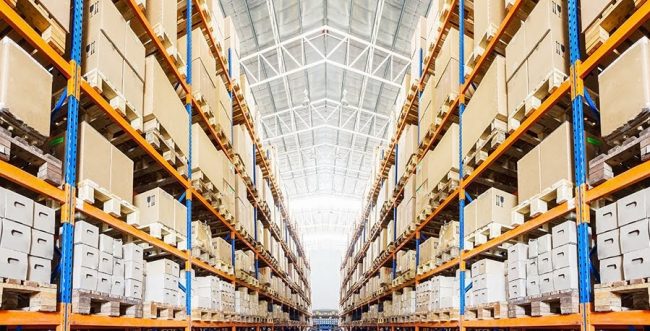 Rows of shelves with boxes in modern warehouse