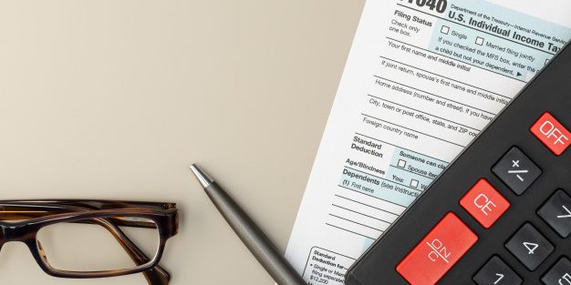 individual-tax-return-form-table-tax-time-concept-top-view-copy-space