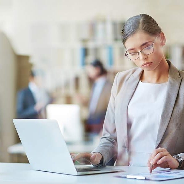 Woman working with laptop in office