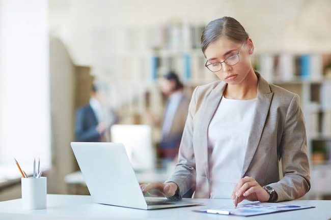 Woman working with laptop in office